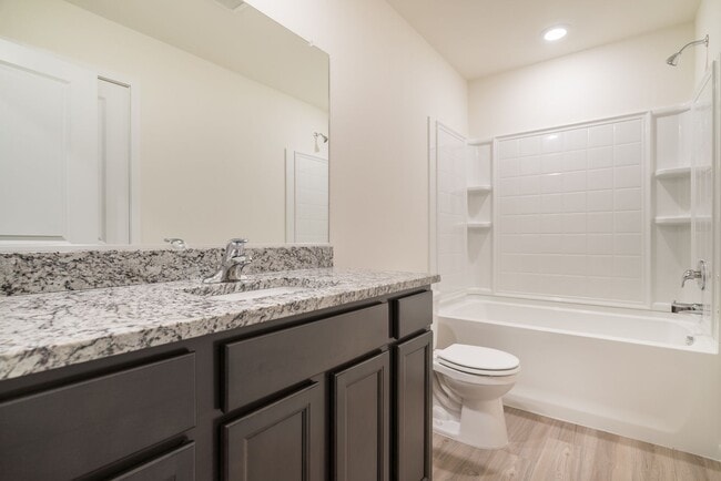 Building Photo - Super clean & spacious 4-bdrm/3-bath townhome in NE—Attached garage, great location