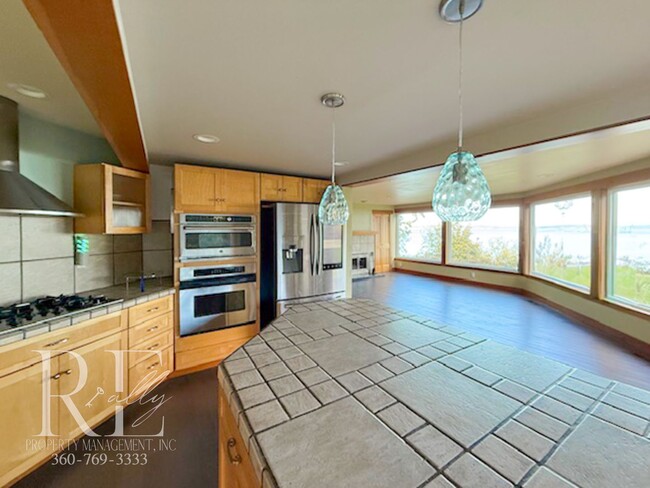 Building Photo - Waterfront Rustic Retreat with Vaulted Ceilings, Picture Windows & Lofted Nook