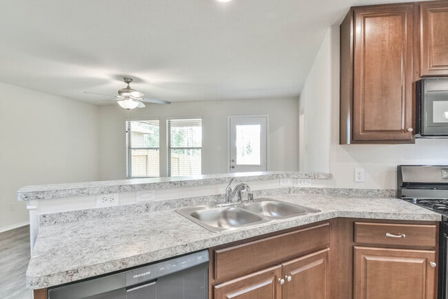 Building Photo - The Village at Caney Mills