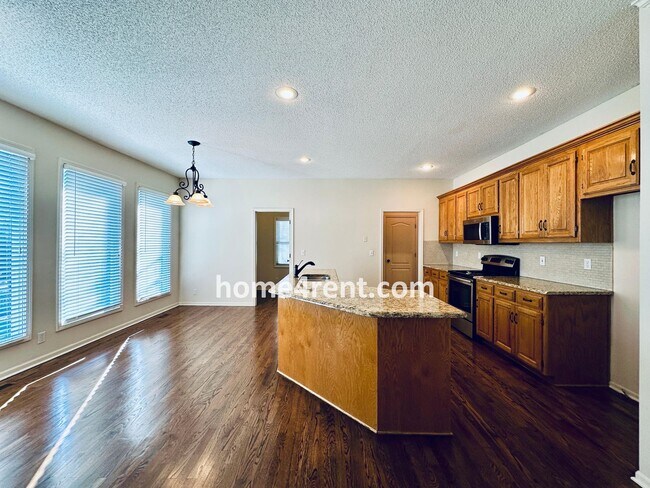 Building Photo - Blue Valley Northwest home on a cul-de-sac w/ granite counters, ss appliances and fenced yard!