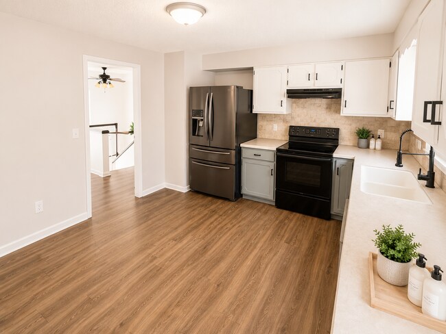 Building Photo - Spacious West Manhattan Home with Modern Updates, Oversized Garage & Prime Location
