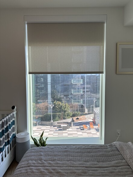 Bedroom with 2 roller shades - 188 W Saint James St