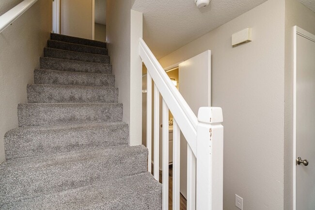 Building Photo - Recently Updated with Wood Laminate Flooring and Fresh Paint