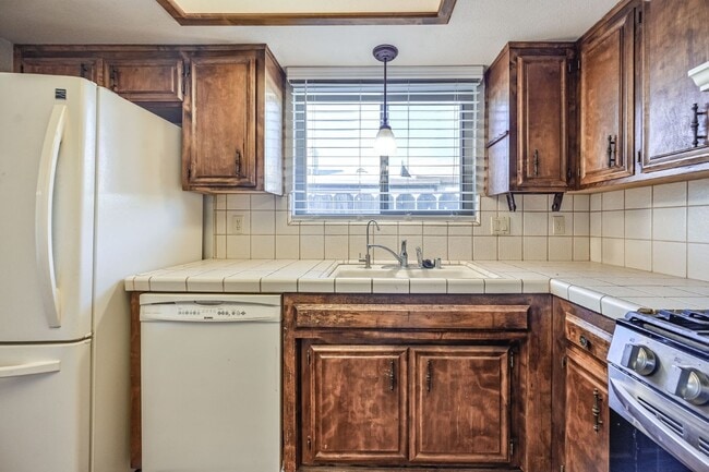 Building Photo - 3 bedroom, 2 bath with large living room and brick fireplace.  Good size kitchen with tons of cab...