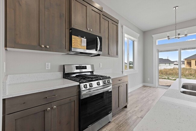 Building Photo - NEW HOME with large garage stalls and unfinished basement for additional storage