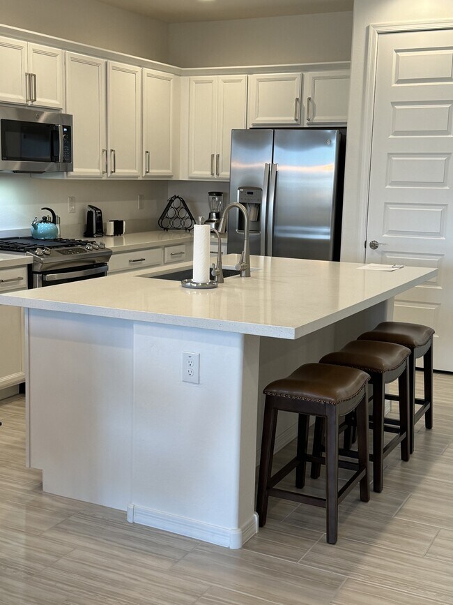 Kitchen with Island Seating - 8908 W Oregon Ave
