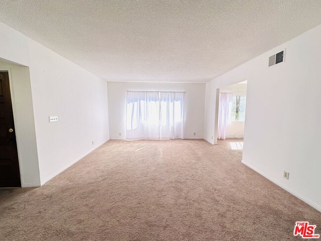 Building Photo - 6069 1/2 Cashio St