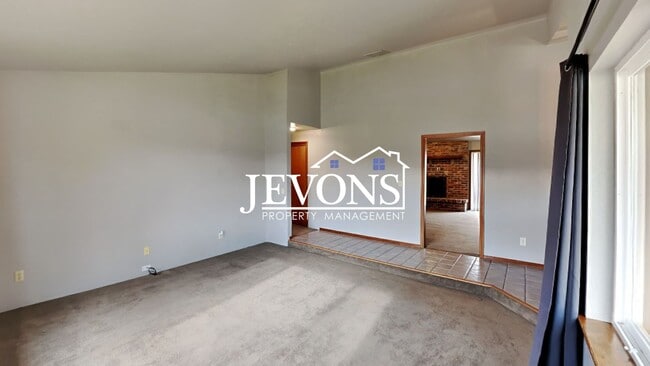 Building Photo - Enjoy this 3-bedroom home featuring a fully equipped kitchen, a two-car attached garage, and a fe...