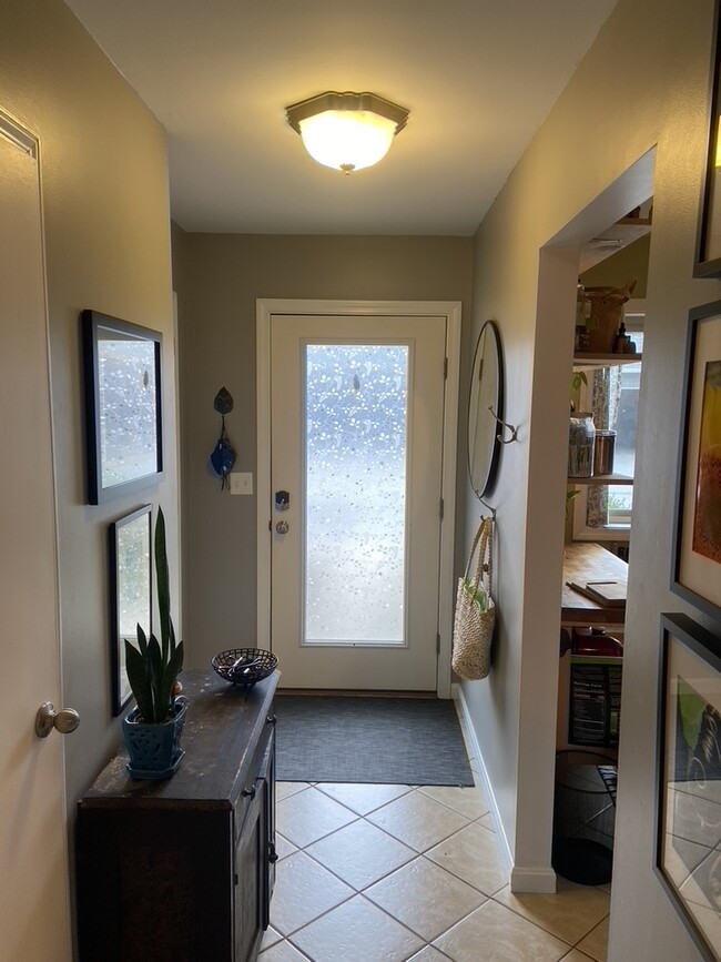 Looking toward front door, kitchen on the right - 105 Sugar Tree Ln