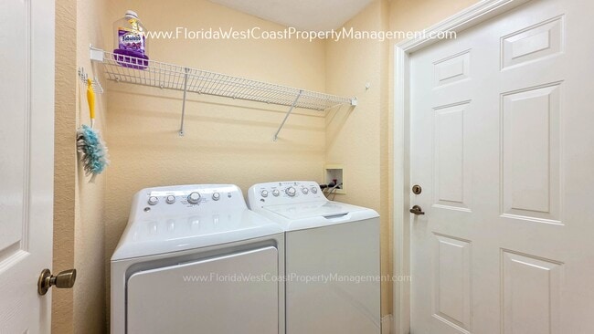 Building Photo - MOVE IN READY! LARGE 2 BEDROOM/2 BATH PLUS ATTACHED GARAGE! TILE/LVP THROUGHOUT!