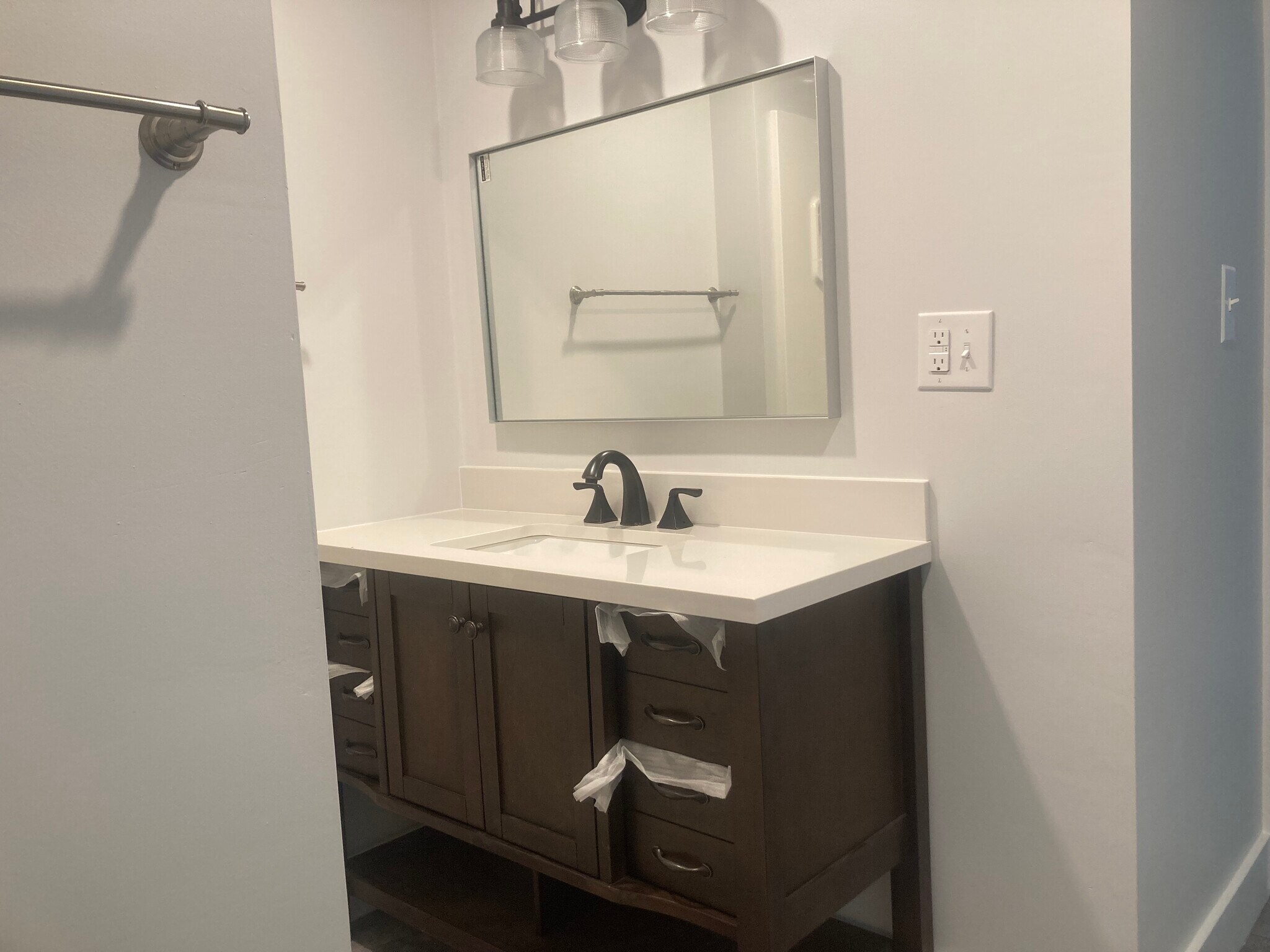 Fully renovated bathroom. New 48 inch vanity. Two sets of lighting, over sink and ceiling. - 35 Main St