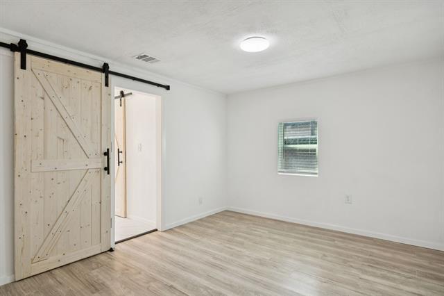 Building Photo - 303 N Delphine St