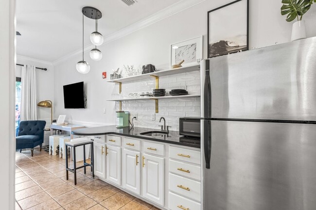 Building Photo - 50% off first months rent.  Cute Furnished...
