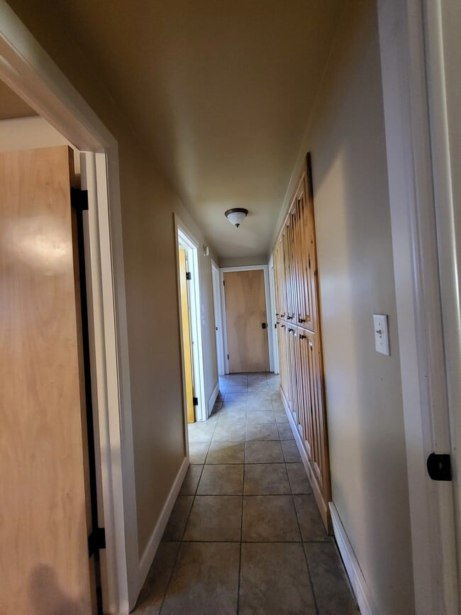 Hallway with storage cabinets-main floor - 1905 Saint Marys Dr