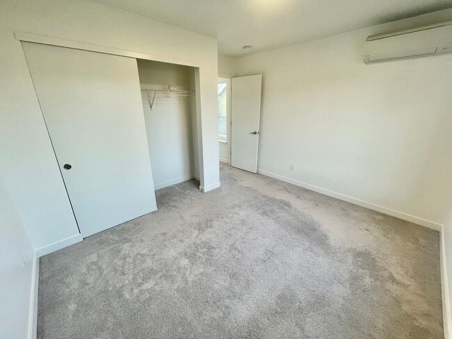 Building Photo - Sleek Townhome with Garage and Private Pat...