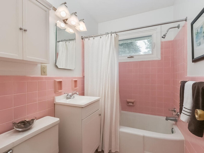 This charming vintage bathroom is in great condition and has lots of storage. - 4328 York Ave S