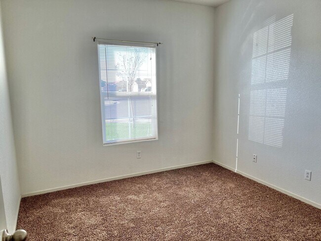 Building Photo - Large Corner Lot Home with Landscaping included!