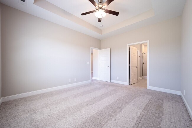 Building Photo - Elegant Home with Stone Fireplace, Kitchen Island and Designer Primary Suite