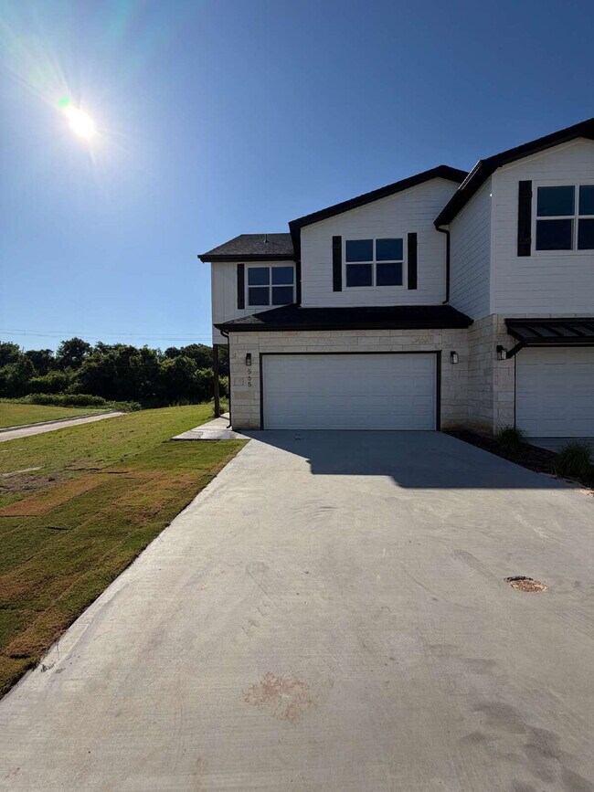 Building Photo - FOUR bedroom townhome. Can't get any closer to campus than this!