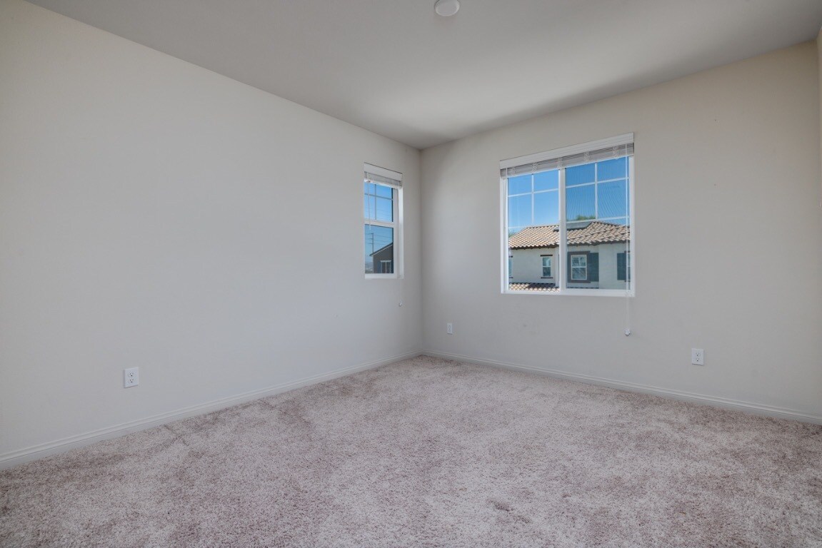 Second upstairs bedroom featuring soft carpet flooring - 26549 Brightstone Dr