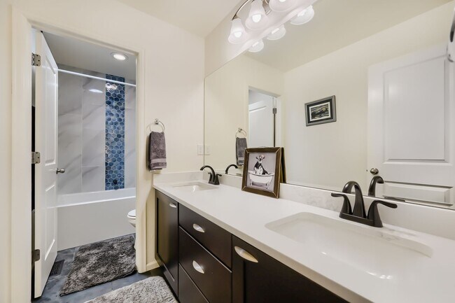 Building Photo - Stunning & Contemporary 4-Bedroom Home on Open Space-Available July 1st!