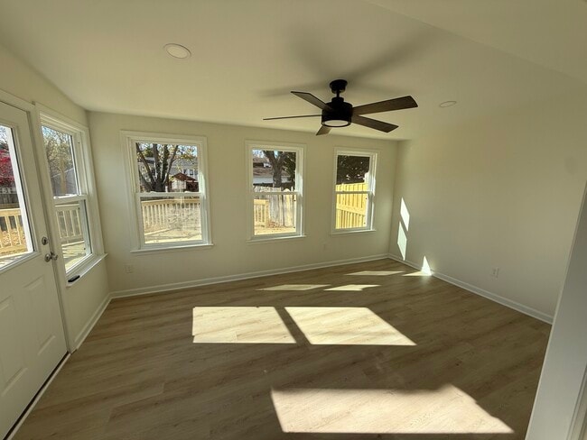Beautiful sunroom with ceiling fan and natural light - 113 Catoctin Cir NE