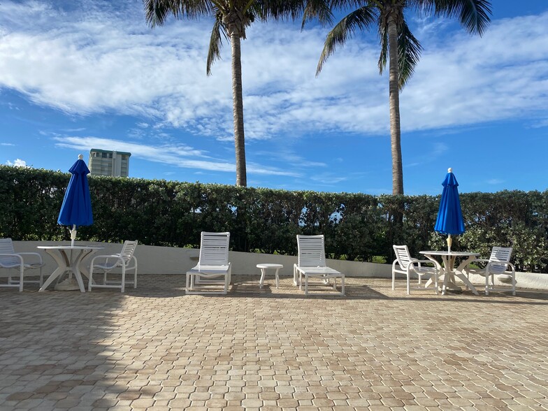 Umbrellas and new chairs - 9650 S Ocean Dr