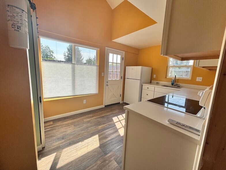 Entrance to the kitchen. East- and south-facing windows. Vaulted ceiling. - 5636 SE Ogden St