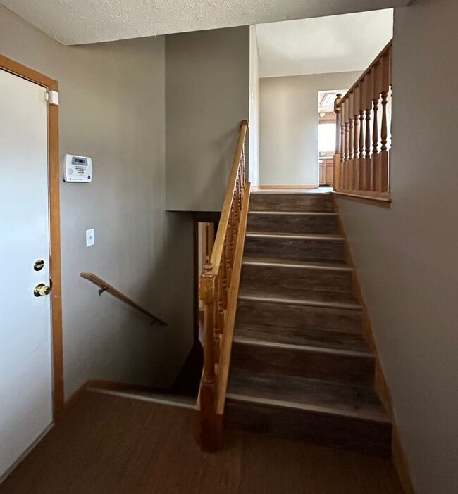 Building Photo - NE House for Rent 4 bedroom 2 full bathroom fenced in yard 2 Car attached garage.