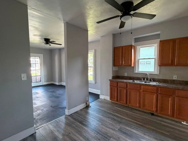 Building Photo - Four bedrooms. A sunroom. A fenced yard. A garage. Your next home is ready to be discovered!