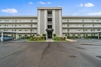 Building Photo - first-floor unit featuring a 2 bedroom, 2 ...