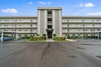 Building Photo - first-floor unit featuring a 2 bedroom, 2 bath fully furnished