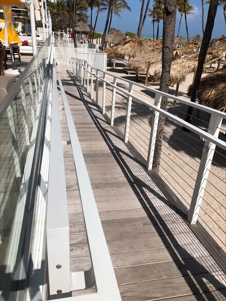 Easy beach access with the wheelchair ramp to the beach. - 16699 Collins Ave