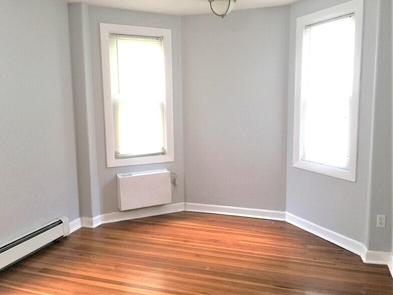light-filled bedroom with A/C - 142 Humboldt Ave