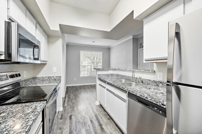 Building Photo - Modern, Pet-Friendly, and Priced Right!