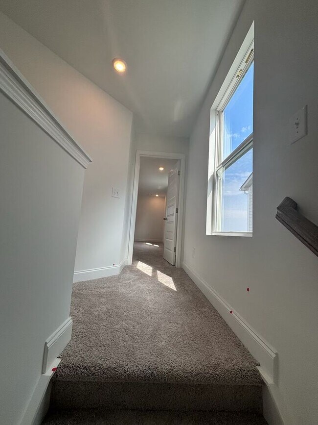 Building Photo - **BE THE LUCKY ONE TO LIVE IN THIS 2024-BUILT END-UNIT TOWNHOME IN A RESORT-STYLE COMMUNITY**