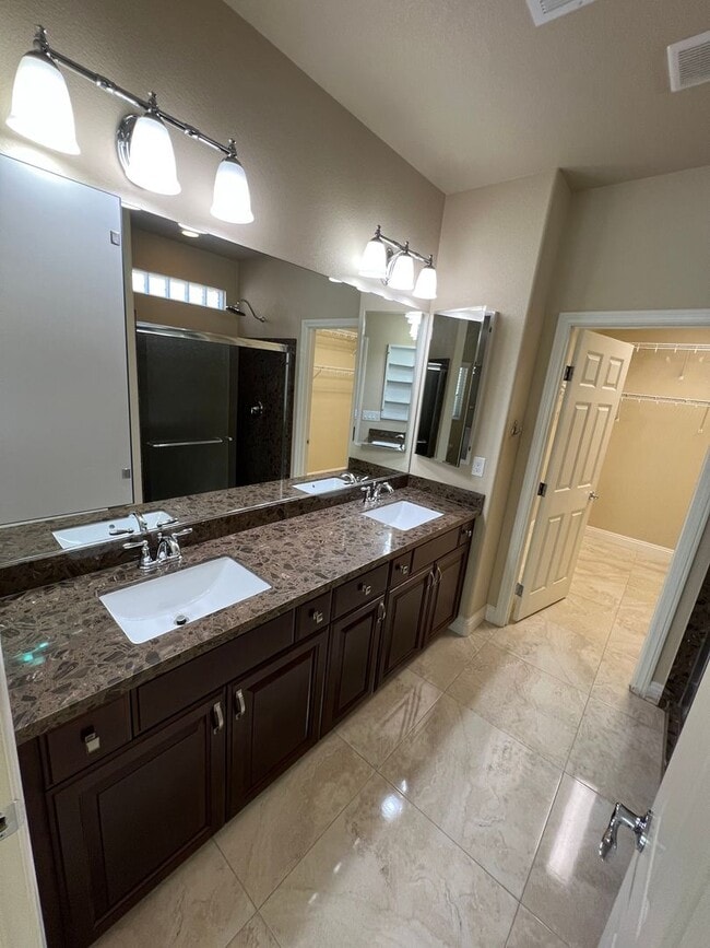 Building Photo - A Fantastic 4 Bedroom Home with the primary Downstairs, in Silverado Ranch