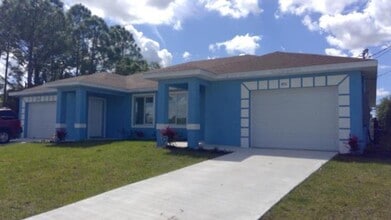 Building Photo - Newer Three Bedroom, 2 Bath, 1 Car garage-...
