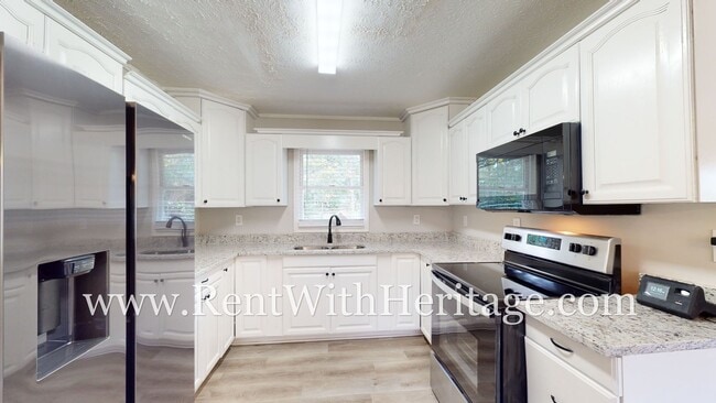 Building Photo - GORGEOUS BRICK RANCH WITH ALL THE UPGRADES...