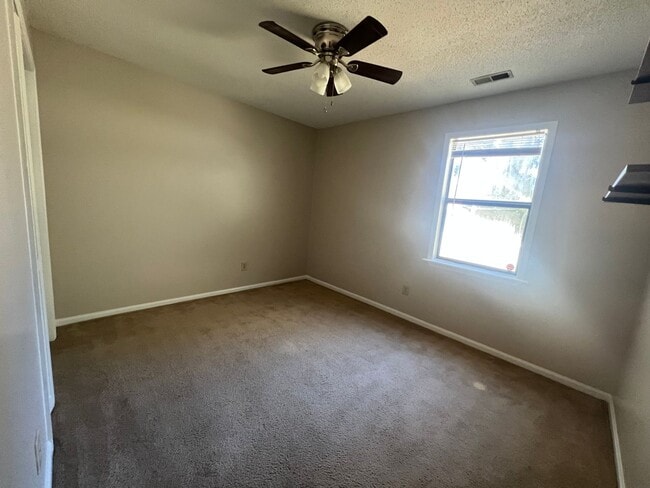 Building Photo - Delightful three bedroom two bath home in a serene country setting in Hubert. Just a short drive ...