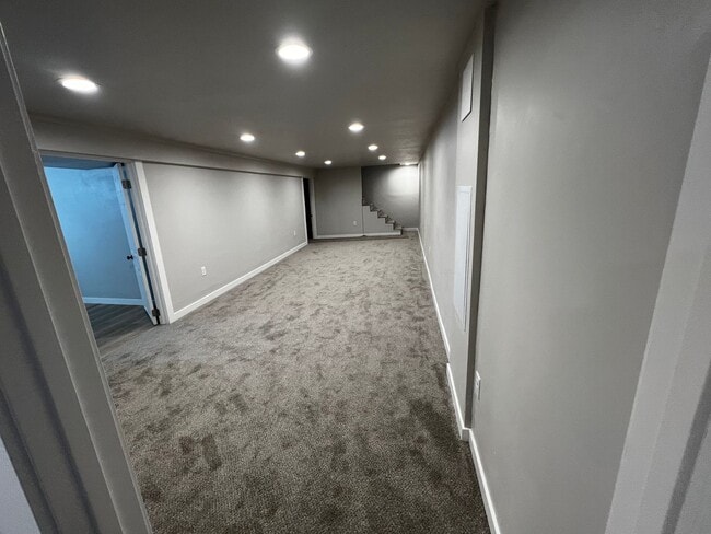 Building Photo - Spacious 4-Bedroom Home with Finished Basement & Garage