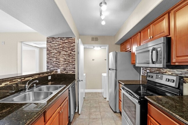 Building Photo - SE!!! Gated!! 1 Bedroom 1st Floor!! One Car Garage!!! Community Pool, Spa, Clubhouse!!! All tile ...