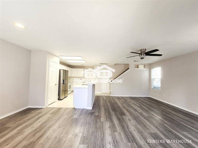 Building Photo - This gem of a townhome is nestled in the w...