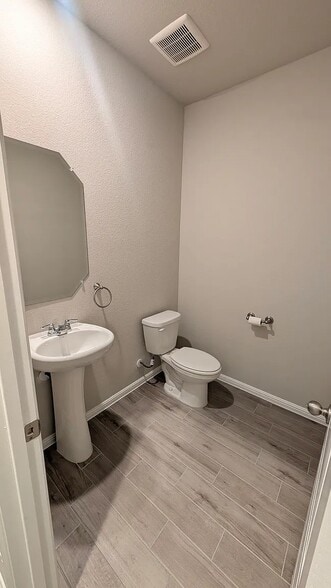 1st floor powder bathroom - 3417 Lake District Ln