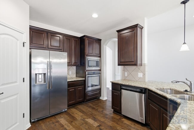 Building Photo - 8336 Paola St