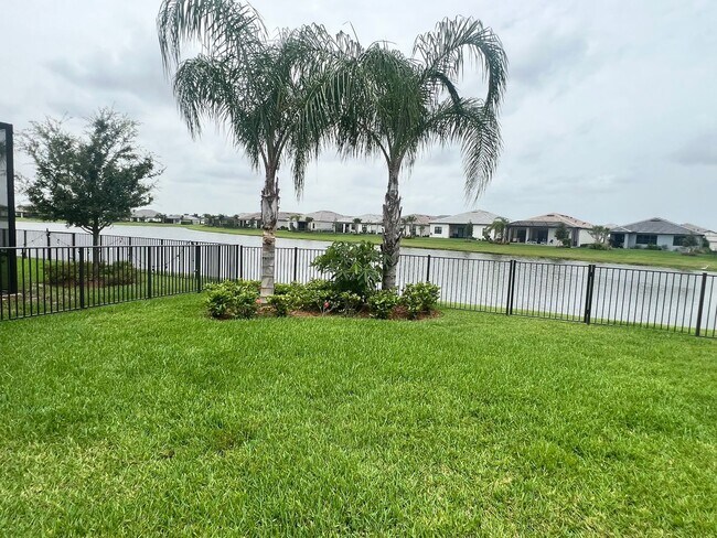 Building Photo - STUNNING LAKEFRONT 3 BEDROOM, 2.5 BATH HOM...