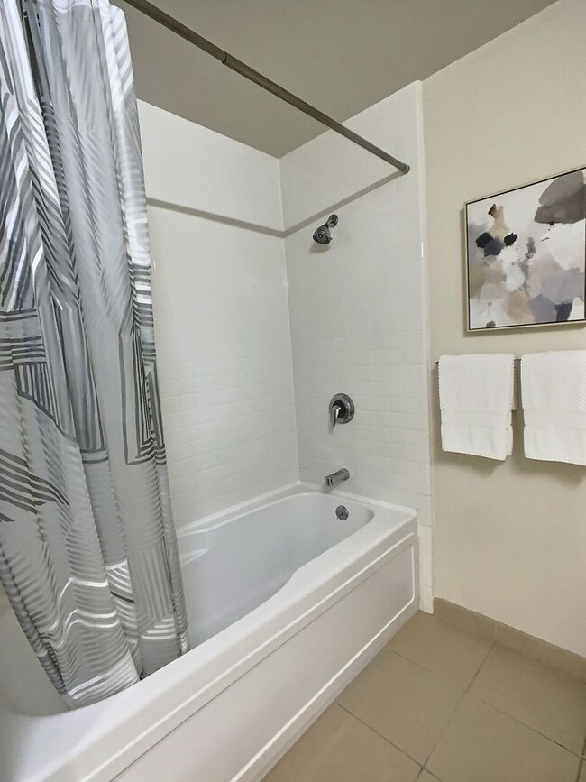 Building Photo - Gorgeous 1 Bedroom Condo at Axis with Den