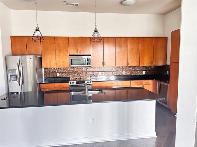 Building Photo - 711 Cosmopolitan Dr NE