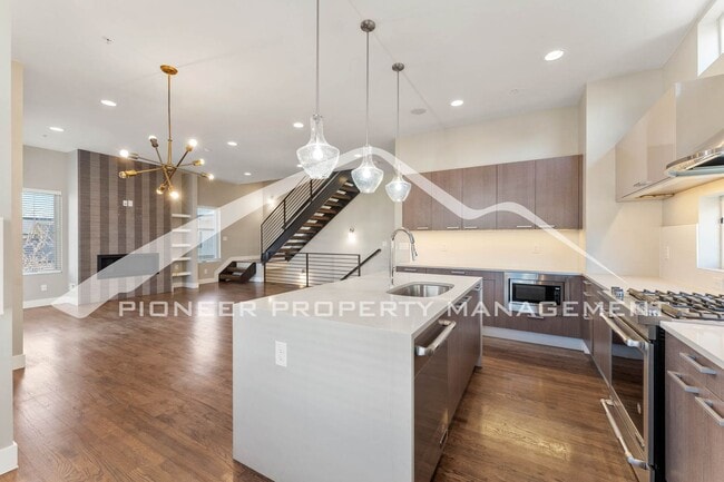 Building Photo - Fantastic Townhome with A Roof Top Patio, Attached Garage, and Central AC!