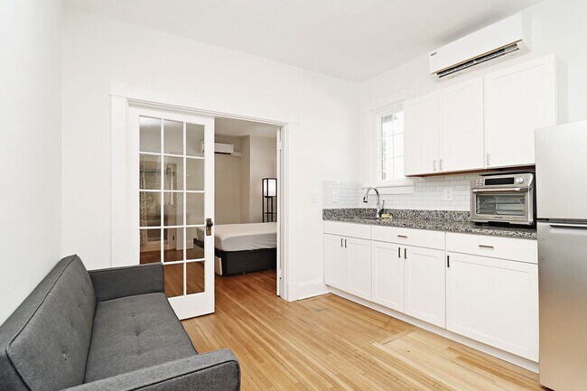 Building Photo - Furnished, Light-Filled Apartment With Utilities Included